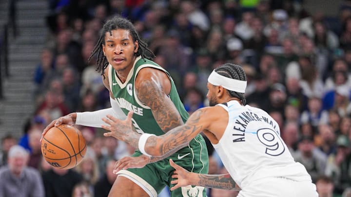 Feb 12, 2025; Minneapolis, Minnesota, USA; Milwaukee Bucks guard Kevin Porter Jr. (3) dribbles against Minnesota Timberwolves guard Nickeil Alexander-Walker (9) in the fourth quarter at Target Center. Mandatory Credit: Brad Rempel-Imagn Images Feb 12, 2025; Minneapolis, Minnesota, USA; Milwaukee Bucks guard Kevin Porter Jr. (3) dribbles against Minnesota Timberwolves guard Nickeil Alexander-Walker (9) in the fourth quarter at Target Center. Mandatory Credit: Brad Rempel-Imagn Images