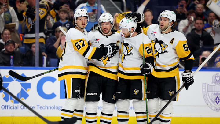 Mar 27, 2025; Buffalo, New York, USA;  Pittsburgh Penguins center Sidney Crosby (87) celebrates his goal with teammates during the first period against the Buffalo Sabres at KeyBank Center. Mandatory Credit: Timothy T. Ludwig-Imagn Images