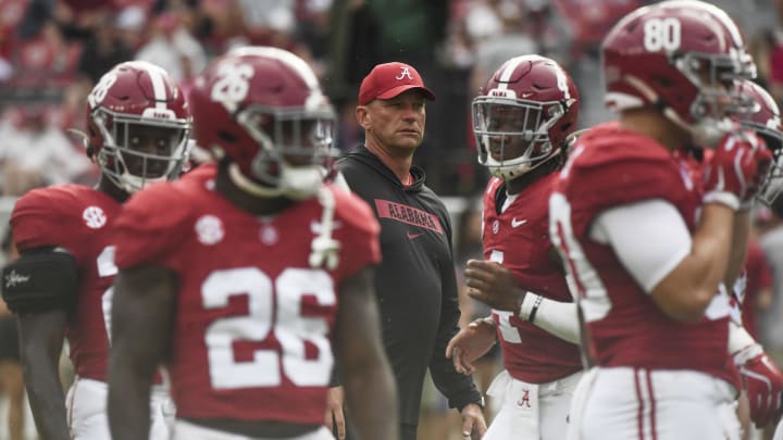 Aug 31, 2024; Tuscaloosa, Alabama, USA; Alabama Crimson Tide head coach Kalen DeBoer watches his team warm up before a game against the Western Kentucky Hilltoppers at Bryant-Denny Stadium. The game will be the first with DeBoer as head coach of the Crimson Tide. Aug 31, 2024; Tuscaloosa, Alabama, USA; Alabama Crimson Tide head coach Kalen DeBoer watches his team warm up before a game against the Western Kentucky Hilltoppers at Bryant-Denny Stadium. The game will be the first with DeBoer as head coach of the Crimson Tide.