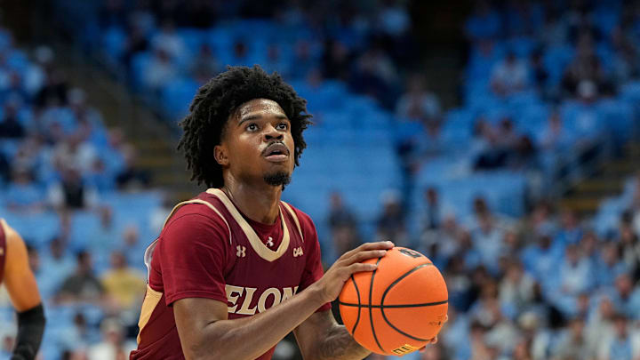 Nov 4, 2024; Chapel Hill, North Carolina, USA;  Elon Phoenix guard TK Simpkins (3) shoots a free throw in the first half at Dean E. Smith Center. Mandatory Credit: Bob Donnan-Imagn Images