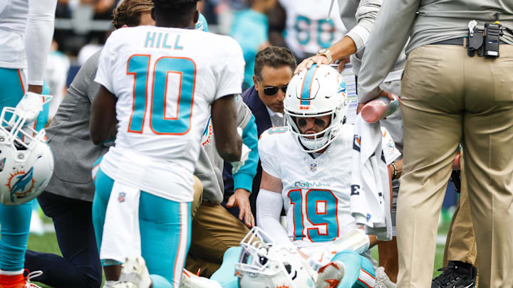 Sep 22, 2024; Seattle, Washington, USA; Miami Dolphins quarterback Skylar Thompson (19) receives medical attention after suffering an injury during the third quarter against the Seattle Seahawks at Lumen Field. Mandatory Credit: Joe Nicholson-Imagn Images