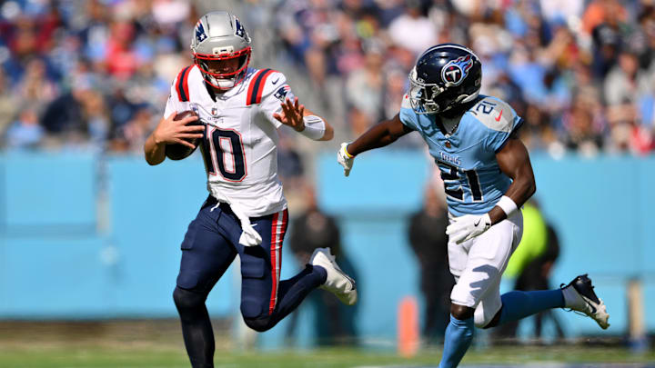 Oct 19, 2025; Nashville, Tennessee, USA; New England Patriots quarterback Drake Maye (10) runs with the ball against Tennessee Titans cornerback Roger McCreary (21) during the second half at Nissan Stadium. Mandatory Credit: Steve Roberts-Imagn Images Oct 19, 2025; Nashville, Tennessee, USA; New England Patriots quarterback Drake Maye (10) runs with the ball against Tennessee Titans cornerback Roger McCreary (21) during the second half at Nissan Stadium. Mandatory Credit: Steve Roberts-Imagn Images