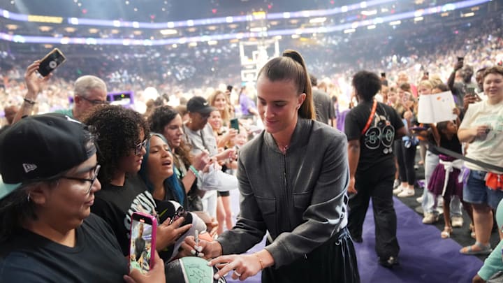 New York Liberty player Sabrina Ionescu signs autographs for fans before their game against the Mercury at PHX Arena on Aug 30, 2025, in Phoenix.