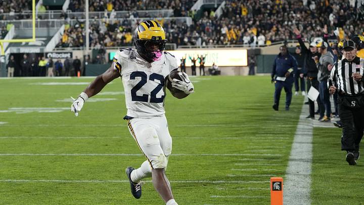 Oct 25, 2025; East Lansing, Michigan, USA; Michigan Wolverines running back Justice Haynes (22) carries the ball for a touchdown against the Michigan State Spartans during the second half at Spartan Stadium. Mandatory Credit: Brendan Mullin-Imagn Images Oct 25, 2025; East Lansing, Michigan, USA; Michigan Wolverines running back Justice Haynes (22) carries the ball for a touchdown against the Michigan State Spartans during the second half at Spartan Stadium. Mandatory Credit: Brendan Mullin-Imagn Images