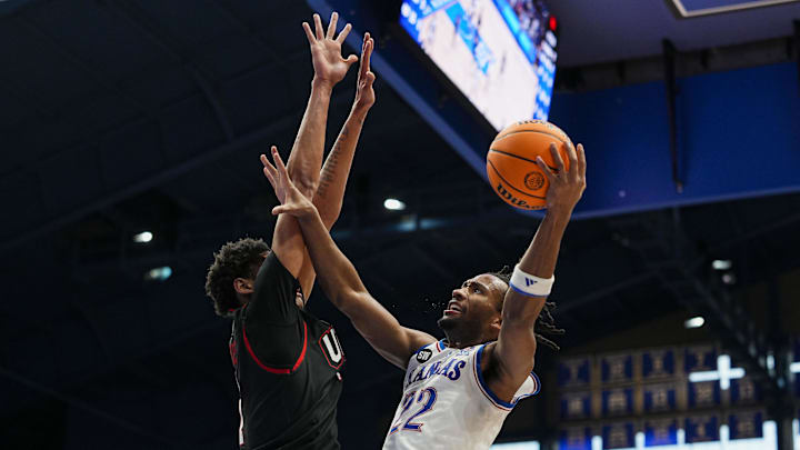 Feb 7, 2026; Lawrence, Kansas, USA; Kansas Jayhawks guard Darryn Peterson (22) shoots against Utah Utes forward Josh Hayes (7) during the second half at Allen Fieldhouse. Mandatory Credit: Jay Biggerstaff-Imagn Images
