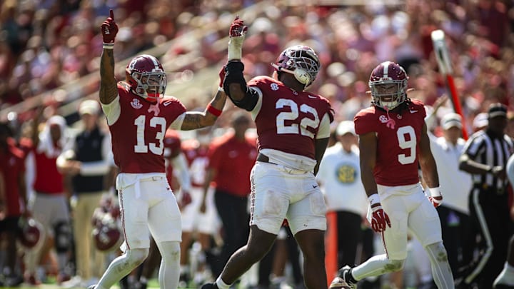 Oct 12, 2024; Tuscaloosa, Alabama, USA; Alabama Crimson Tide defensive back Malachi Moore (13), lineman LT Overton (22), and defensive back Jaylen Mbakwe (9) react to recovering a fumble by the South Carolina Gamecocks during the fourth quarter at Bryant-Denny Stadium. Mandatory Credit: Will McLelland-Imagn Images