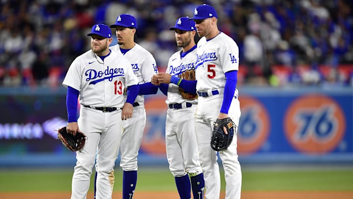 Apr 3, 2023; Los Angeles, California, USA; Los Angeles Dodgers third baseman Max Muncy (13) second baseman Miguel Vargas (17) shortstop Chris Taylor (3) and first baseman Freddie Freeman (5) during a pitching change in the fifth inning at Dodger Stadium. Mandatory Credit: Gary A. Vasquez-Imagn Images