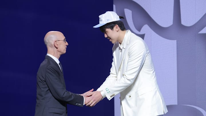 Jun 25, 2025; Brooklyn, NY, USA; Yang Hansen greets NBA commissioner Adam Silver after being selected as the 16th pick by the Memphis Grizzlies in the first round of the 2025 NBA Draft at Barclays Center. Mandatory Credit: Brad Penner-Imagn Images Jun 25, 2025; Brooklyn, NY, USA; Yang Hansen greets NBA commissioner Adam Silver after being selected as the 16th pick by the Memphis Grizzlies in the first round of the 2025 NBA Draft at Barclays Center. Mandatory Credit: Brad Penner-Imagn Images