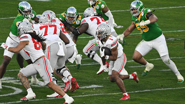Jan 1, 2025; Pasadena, CA, USA; Ohio State Buckeyes running back Quinshon Judkins (1) carries the ball during the fourth quarter against the Oregon Ducks at Rose Bowl Stadium. Mandatory Credit: Robert Hanashiro-Imagn Images