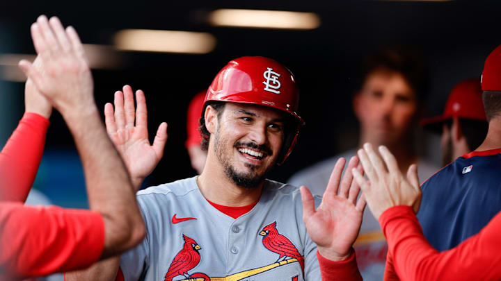 Jul 21, 2025; Denver, Colorado, USA; St. Louis Cardinals third baseman Nolan Arenado (28) celebrates in the dugout after scoring on an RBI in the fourth inning against the Colorado Rockies at Coors Field. Mandatory Credit: Isaiah J. Downing-Imagn Images