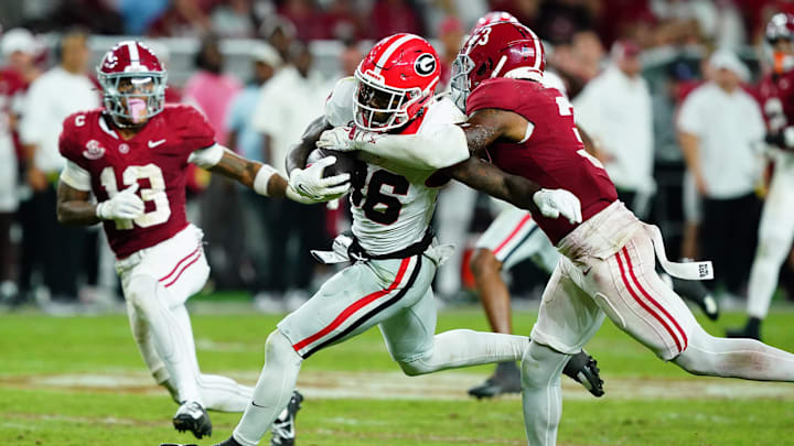Sep 28, 2024; Tuscaloosa, Alabama, USA;  Georgia Bulldogs wide receiver Dillon Bell (86) runs the ball against Alabama Crimson Tide defensive back Keon Sabb (3) and defensive back Malachi Moore (13) during the fourth quarter at Bryant-Denny Stadium. Mandatory Credit: John David Mercer-Imagn Images