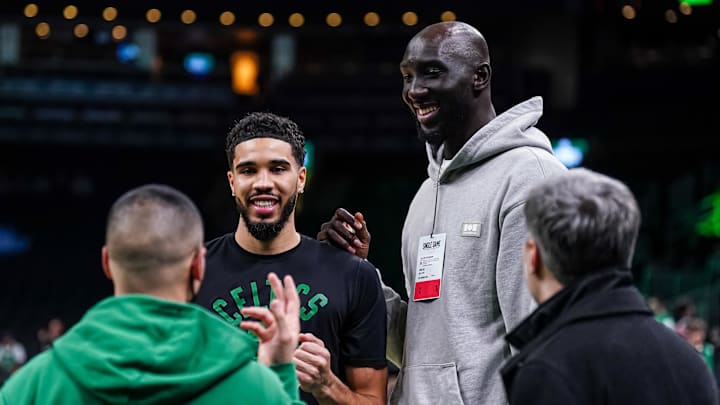 May 11, 2022; Boston, Massachusetts, USA; Boston Celtics forward Jayson Tatum (0) with former Celtic Tacko Fall before the start of game five of the second round for the 2022 NBA playoffs against the Milwaukee Bucks at TD Garden. Mandatory Credit: David Butler II-Imagn Images