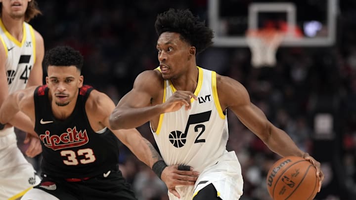 Dec 14, 2023; Portland, Oregon, USA; Utah Jazz point guard Collin Sexton (2) dribbles the ball while defended by Portland Trail Blazers forward Toumani Camara (33) during the first half at Moda Center. Mandatory Credit: Soobum Im-Imagn Images