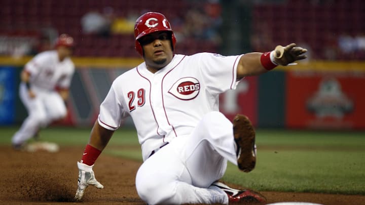 Sep 5, 2015; Cincinnati, OH, USA; Cincinnati Reds catcher Brayan Pena is forced out at third base against the Milwaukee Brewers during the second inning in game two of a doubleheader at Great American Ball Park. Mandatory Credit: David Kohl-Imagn Images