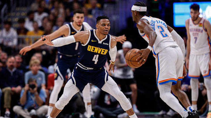 May 11, 2025; Denver, Colorado, USA; Oklahoma City Thunder guard Shai Gilgeous-Alexander (2) controls the ball as Denver Nuggets guard Russell Westbrook (4) guards in the third quarter during game four of the second round of the 2025 NBA Playoffs at Ball Arena. Mandatory Credit: Isaiah J. Downing-Imagn Images