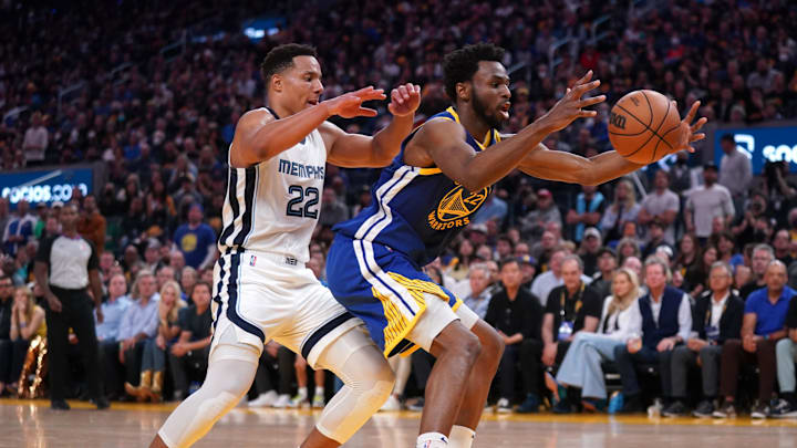 Golden State Warriors forward Andrew Wiggins (22) holds onto a rebound next to Memphis Grizzlies guard Desmond Bane (22) in the fourth quarter during game six of the second round for the 2022 NBA playoffs at Chase Center. Mandatory Credit: Cary Edmondson-Imagn Images