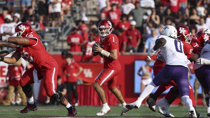 Nov 22, 2025; Houston, Texas, USA; Houston Cougars quarterback Conner Weigman (1) looks for an open receiver during the first quarter against the TCU Horned Frogs at TDECU Stadium. Mandatory Credit: Troy Taormina-Imagn Images Nov 22, 2025; Houston, Texas, USA; Houston Cougars quarterback Conner Weigman (1) looks for an open receiver during the first quarter against the TCU Horned Frogs at TDECU Stadium. Mandatory Credit: Troy Taormina-Imagn Images