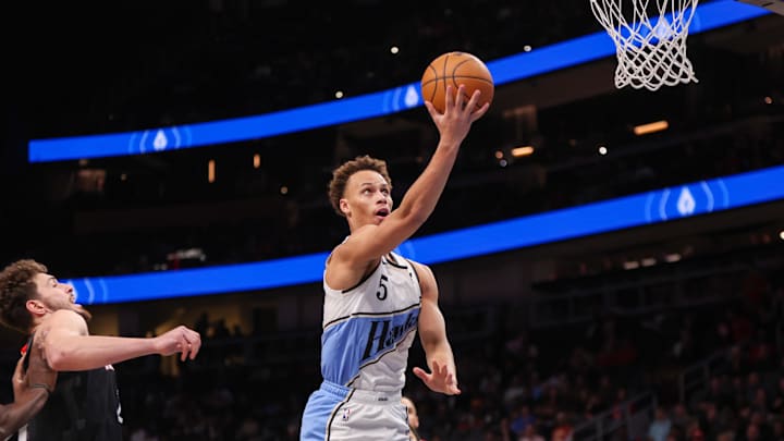 Jan 28, 2025; Atlanta, Georgia, USA; Atlanta Hawks guard Dyson Daniels (5) shoots against the Houston Rockets in the first quarter at State Farm Arena. Mandatory Credit: Brett Davis-Imagn Images