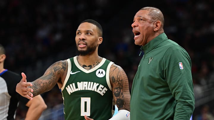 Feb 27, 2025; Milwaukee, Wisconsin, USA;  Milwaukee Bucks head coach Doc Rivers and guard Damian Lillard (0) reacts in the fourth quarter against the Denver Nuggets at Fiserv Forum. Mandatory Credit: Benny Sieu-Imagn Images