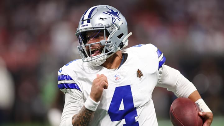 Dallas Cowboys quarterback Dak Prescott (4) runs the ball against the Atlanta Falcons in the second quarter at Mercedes-Benz Stadium. Dallas Cowboys quarterback Dak Prescott (4) runs the ball against the Atlanta Falcons in the second quarter at Mercedes-Benz Stadium.
