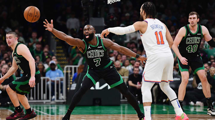 May 14, 2025; Boston, Massachusetts, USA; New York Knicks guard Jalen Brunson (11) passes the ball past Boston Celtics guard Jaylen Brown (7) in the second half during game five of the second round for the 2025 NBA Playoffs at TD Garden. Mandatory Credit: Bob DeChiara-Imagn Images