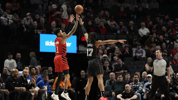 Feb 8, 2024; Portland, Oregon, USA; Portland Trail Blazers shooting guard Anfernee Simons (1) shoots the ball over Detroit Pistons guard Stanley Umude (17) during the first half at Moda Center. Mandatory Credit: Soobum Im-Imagn Images