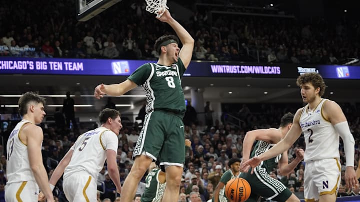 Jan 12, 2025; Evanston, Illinois, USA; Michigan State Spartans forward Frankie Fidler (8) dunks the ball on Northwestern Wildcats guard Brooks Barnhizer (13) during the first half at Welsh-Ryan Arena. Mandatory Credit: David Banks-Imagn Images Jan 12, 2025; Evanston, Illinois, USA; Michigan State Spartans forward Frankie Fidler (8) dunks the ball on Northwestern Wildcats guard Brooks Barnhizer (13) during the first half at Welsh-Ryan Arena. Mandatory Credit: David Banks-Imagn Images