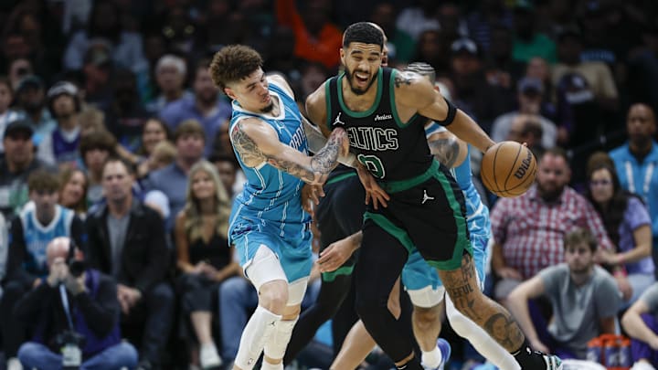 Nov 2, 2024; Charlotte, North Carolina, USA; Boston Celtics forward Jayson Tatum (0) collides with Charlotte Hornets guard LaMelo Ball (1) during the second half at Spectrum Center. Mandatory Credit: Nell Redmond-Imagn Images Nov 2, 2024; Charlotte, North Carolina, USA; Boston Celtics forward Jayson Tatum (0) collides with Charlotte Hornets guard LaMelo Ball (1) during the second half at Spectrum Center. Mandatory Credit: Nell Redmond-Imagn Images