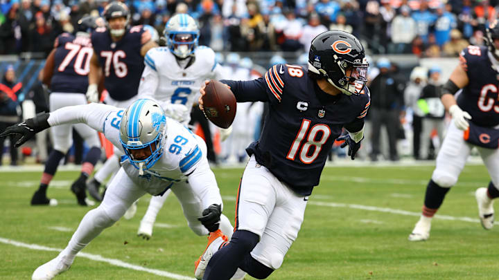 Chicago Bears quarterback Caleb Williams attempts to avoid a feisty Detroit Lions defense.