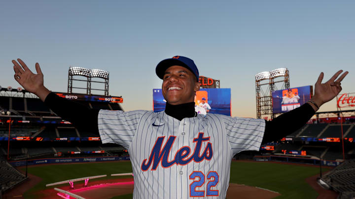 New York Mets right fielder Juan Soto poses for photos during his introductory press conference at Citi Field in 2024.