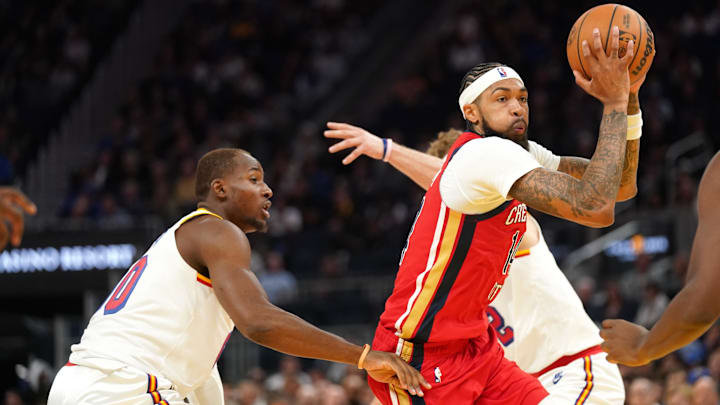 New Orleans Pelicans forward Brandon Ingram (14) drives past Golden State Warriors forward Jonathan Kuminga (00) in the third quarter at the Chase Center. Mandatory Credit: Cary Edmondson-Imagn Images