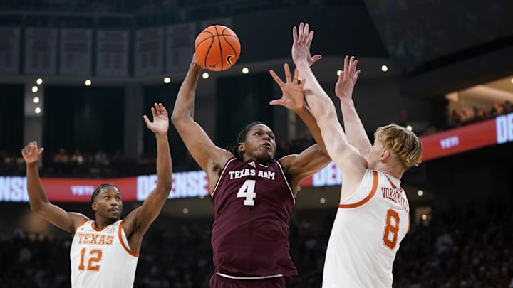 Jan 17, 2026; Austin, Texas, USA; Texas A&M Aggies forward Jamie Vinson (4) makes a jump shot against Texas Longhorns center Matas Vokietaitis (8) during the first half at Moody Center. Mandatory Credit: Dustin Safranek-Imagn Images