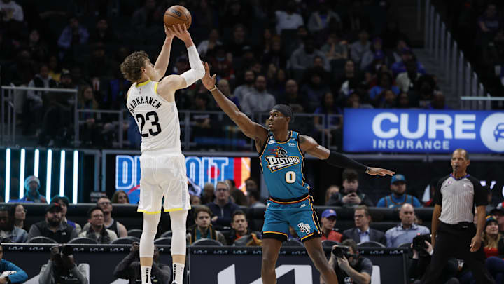 Dec 20, 2022; Detroit, Michigan, USA;  Utah Jazz forward Lauri Markkanen (23) shoots over Detroit Pistons center Jalen Duren (0) in the first half at Little Caesars Arena. Mandatory Credit: Rick Osentoski-Imagn Images