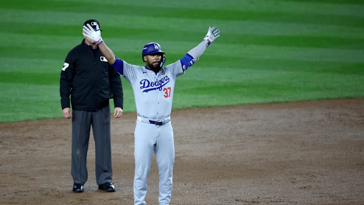 Oct 30, 2024; New York, New York, USA; Los Angeles Dodgers outfielder Teoscar Hernandez (37) celebrates after hitting a two-RBI double during the fifth inning against the New York Yankees in game five of the 2024 MLB World Series at Yankee Stadium. Mandatory Credit: Wendell Cruz-Imagn Images