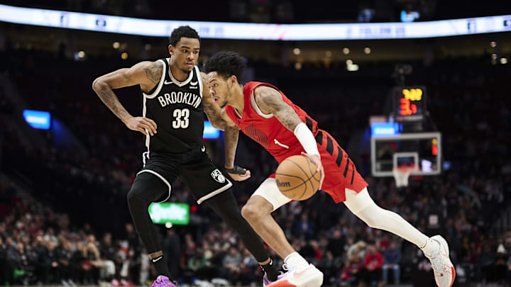 Jan 17, 2024; Portland, Oregon, USA; Portland Trail Blazers guard Anfernee Simons (1) drives to the basket during the second half against Brooklyn Nets center Nic Claxton (33) at Moda Center. Mandatory Credit: Troy Wayrynen-Imagn Images Jan 17, 2024; Portland, Oregon, USA; Portland Trail Blazers guard Anfernee Simons (1) drives to the basket during the second half against Brooklyn Nets center Nic Claxton (33) at Moda Center. Mandatory Credit: Troy Wayrynen-Imagn Images