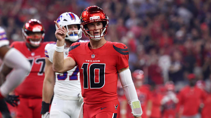 Houston Texans quarterback Davis Mills (10) celebrates after a touchdown against the Buffalo Bills in the second quarter at NRG Stadium. Houston Texans quarterback Davis Mills (10) celebrates after a touchdown against the Buffalo Bills in the second quarter at NRG Stadium.