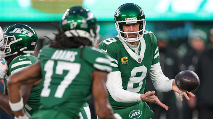 New York Jets quarterback Aaron Rodgers pitches the ball to wide receiver Davante Adams during the first quarter against the Miami Dolphins at MetLife Stadium. New York Jets quarterback Aaron Rodgers pitches the ball to wide receiver Davante Adams during the first quarter against the Miami Dolphins at MetLife Stadium.