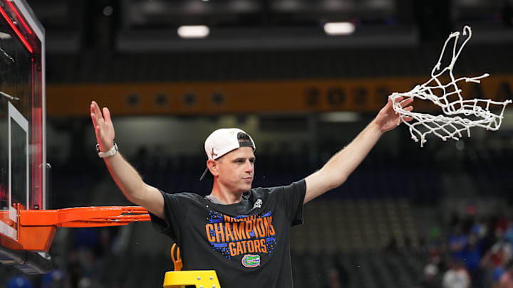 Apr 7, 2025; San Antonio, TX, USA;  Florida Gators head coach Todd Golden cuts down the net after defeating the Houston Cougars in the national championship game of the Final Four of the 2025 NCAA Tournament at the Alamodome. Mandatory Credit: Robert Deutsch-Imagn Images