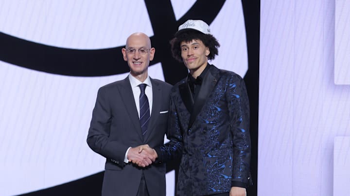 Jun 25, 2025; Brooklyn, NY, USA;  Nolan Traore stands with NBA commissioner Adam Silver after being selected as the 19th pick by the Brooklyn Nets in the first round of the 2025 NBA Draft at Barclays Center. Mandatory Credit: Brad Penner-Imagn Images