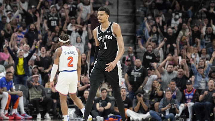 Mar 29, 2024; San Antonio, Texas, USA; San Antonio Spurs forward Victor Wembanyama (1) reacts after scoring a three point basket in overtime against the New York Knicks at Frost Bank Center. Mandatory Credit: Scott Wachter-Imagn Images