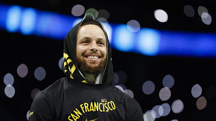 Golden State Warriors guard Stephen Curry (30) smiles as he looks into the crowd during a timeout as the Warriors plays against the Charlotte Hornets during the second half at Spectrum Center. 