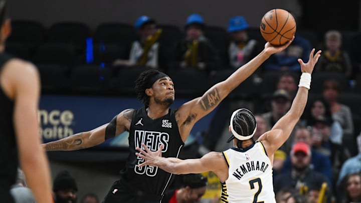 Mar 22, 2025; Indianapolis, Indiana, USA; Brooklyn Nets center Nic Claxton (33) and Indiana Pacers guard Andrew Nembhard (2) go after the ball during the first half at Gainbridge Fieldhouse. Mandatory Credit: Robert Goddin-Imagn Images Mar 22, 2025; Indianapolis, Indiana, USA; Brooklyn Nets center Nic Claxton (33) and Indiana Pacers guard Andrew Nembhard (2) go after the ball during the first half at Gainbridge Fieldhouse. Mandatory Credit: Robert Goddin-Imagn Images