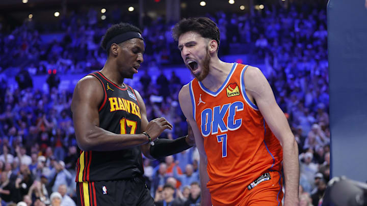 Dec 29, 2025; Oklahoma City, Oklahoma, USA; Oklahoma City Thunder center Chet Holmgren (7) screams next to Atlanta Hawks forward Onyeka Okongwu (17) after dunking against the Atlanta Hawks during the second half at Paycom Center. Mandatory Credit: Alonzo Adams-Imagn Images