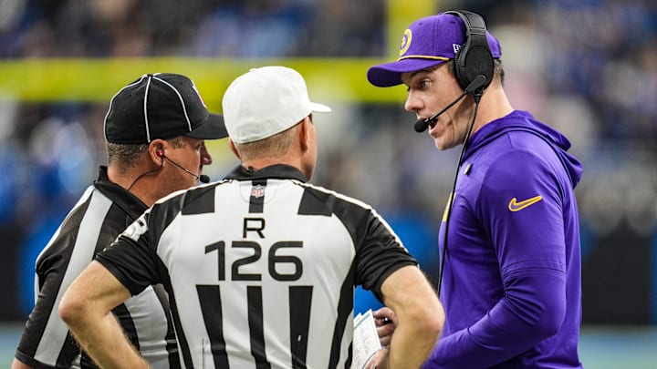 Minnesota Vikings head coach Kevin O’Connell speaks with officials.