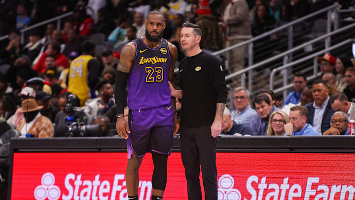 Dec 6, 2024; Atlanta, Georgia, USA; Los Angeles Lakers forward LeBron James (23) talks to head coach JJ Redick against the Atlanta Hawks in the second quarter at State Farm Arena. Mandatory Credit: Brett Davis-Imagn Images