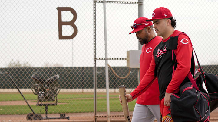 Cincinnati Reds non-roster invitee Sal Stewart walks with Barry Larkin between fields at the Cincinnati Reds Player Development Complex in Goodyear, Ariz., on  Wednesday, Feb. 12, 2025. Mandatory Credit: Sam Greene/USA TODAY NETWORK via Imagn Images