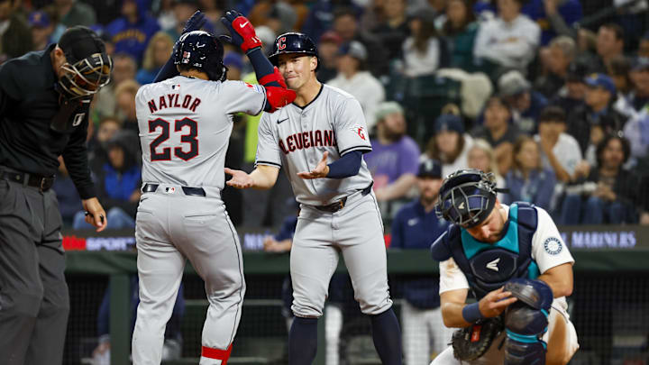 Apr 2, 2024; Seattle, Washington, USA; Cleveland Guardians designated hitter Bo Naylor (23) celebrates with right fielder Will Brennan (17) after hitting a two-run home run against the Seattle Mariners during the fourth inning at T-Mobile Park. Mandatory Credit: Joe Nicholson-USA TODAY Sports