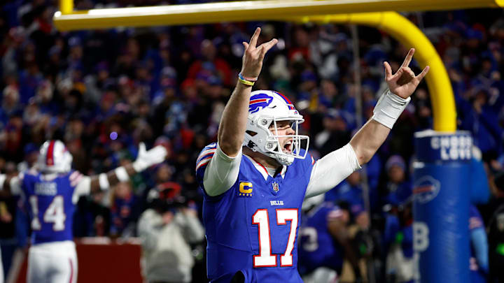 Buffalo Bills quarterback Josh Allen (17) celebrates with fans after his 81 yard touchdown pass to