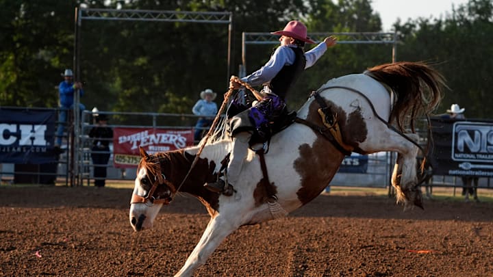 Jarod Torrence of Indian Trail, North Carolina, competes in saddle bronc during the International Finals Youth Rodeo in Shawnee, Okla., Wednesday, July 10, 2024.