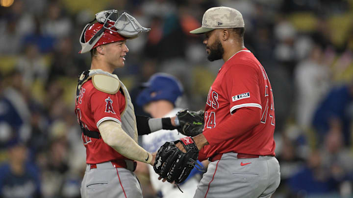 May 16, 2025; Los Angeles, California, USA; Los Angeles Angels catcher Logan O'Hoppe (14) shakes hands with relief pitcher Kenley Jansen (74) after the final out of the ninth inning against the Los Angeles Dodgers at Dodger Stadium. Mandatory Credit: Jayne Kamin-Oncea-Imagn Images
